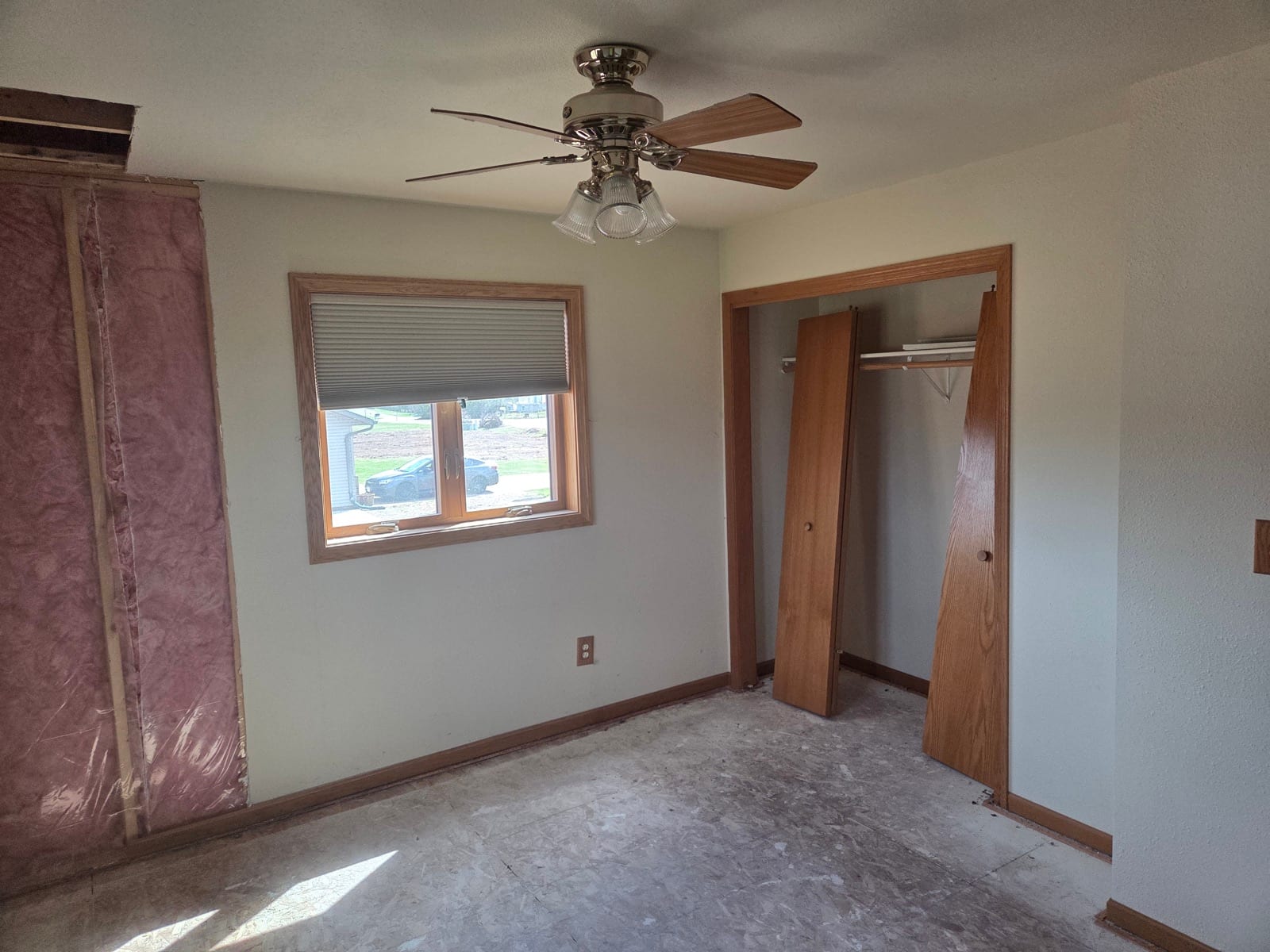 Flood cuts opened along the lower walls with framing exposed for drying.