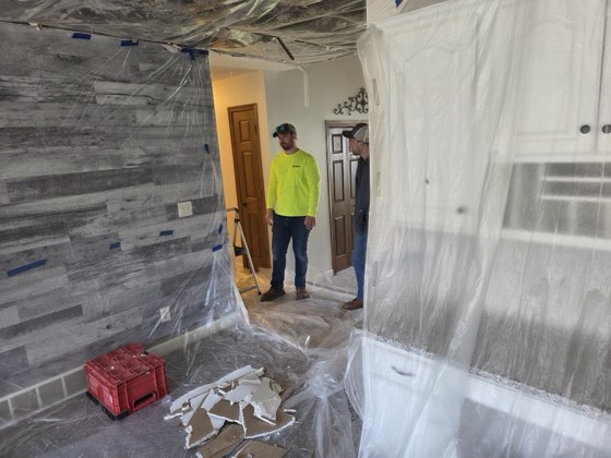 Plastic containment set up for a water-damage dry-down.