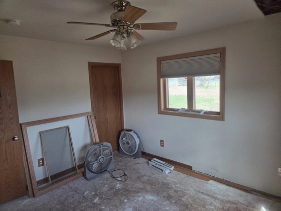 Air movers and dehumidifiers running during a water-damage dry-down.